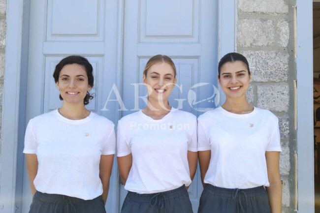Our lovely Hostesses-Promoters welcoming and guiding guests at Hydra island’. (Hostesses welcoming guests – ARGO Promotion)