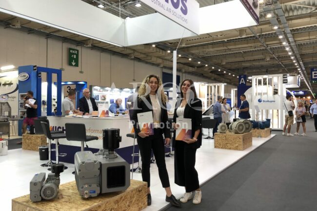 Hostesses-Promoters assisting at the exhibition booth (Exhibition Promoters in Athens Greece-ARGO Promotion)